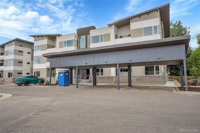 view of building exterior featuring a carport