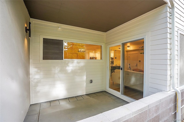 doorway to property with a patio area