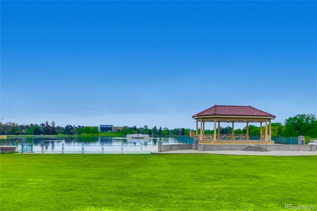 view of community featuring a gazebo, a yard, and a water view