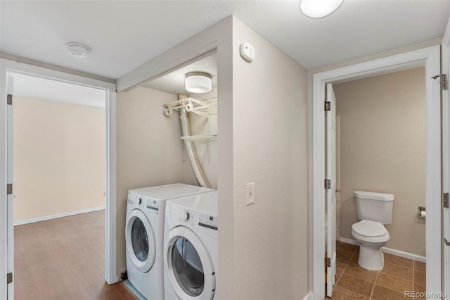 washroom with washing machine and clothes dryer