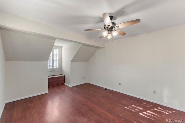 additional living space featuring lofted ceiling, ceiling fan, and dark hardwood / wood-style floors