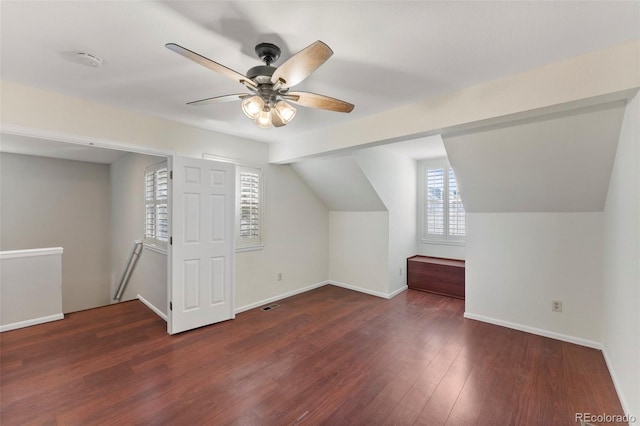 bonus room featuring ceiling fan, lofted ceiling, and dark wood-type flooring