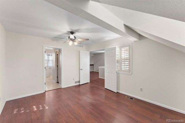 additional living space featuring ceiling fan and dark wood-type flooring