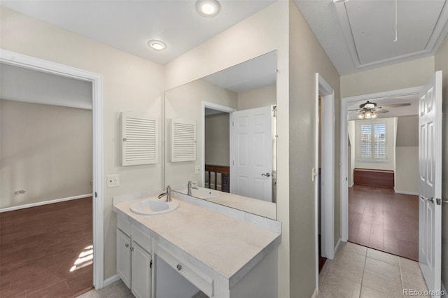 bathroom featuring tile patterned flooring, ceiling fan, and vanity