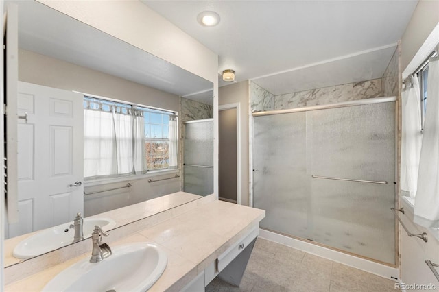 bathroom featuring vanity and a shower with shower door