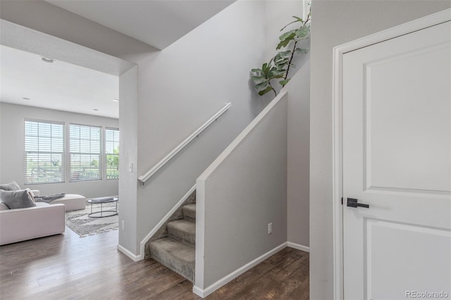 3168 Raintree Ln, Dacono, CO 80514 - stairs with wood finished floors and baseboards