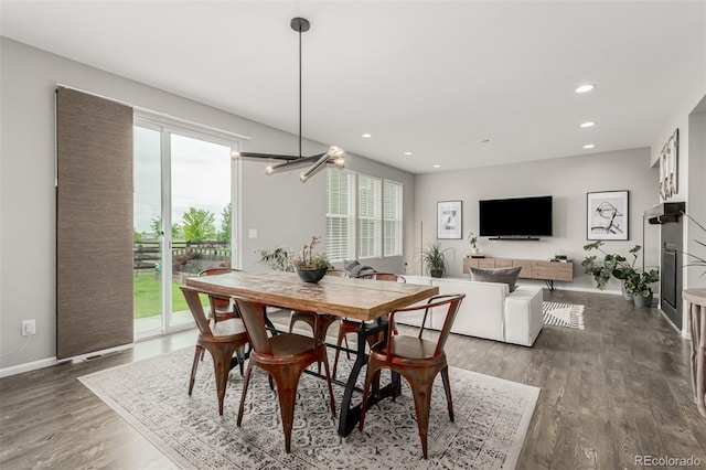 3168 Raintree Ln, Dacono, CO 80514 - dining area with healthy amount of natural light, wood finished floors, and recessed lighting