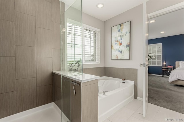 3168 Raintree Ln, Dacono, CO 80514 - full bath with connected bathroom, a bath, tile patterned flooring, a shower, and recessed lighting