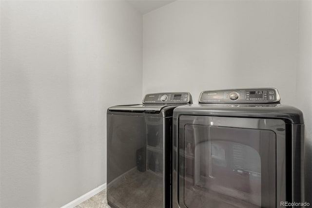 3168 Raintree Ln, Dacono, CO 80514 - laundry area with washing machine and clothes dryer and baseboards