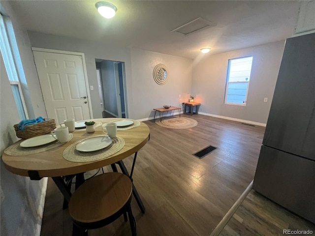 dining area with dark wood-type flooring