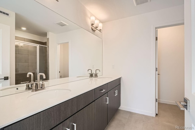 full bathroom featuring tile patterned flooring, visible vents, and a sink