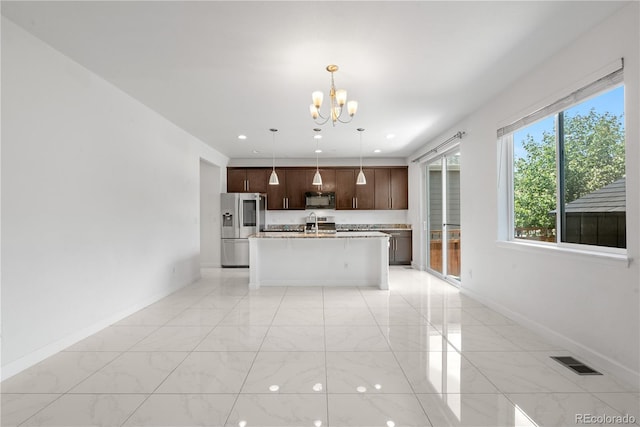 6387 Agave Ave, Castle Rock, CO 80108 - kitchen featuring stainless steel fridge with ice dispenser, a chandelier, black microwave, light countertops, and a center island with sink