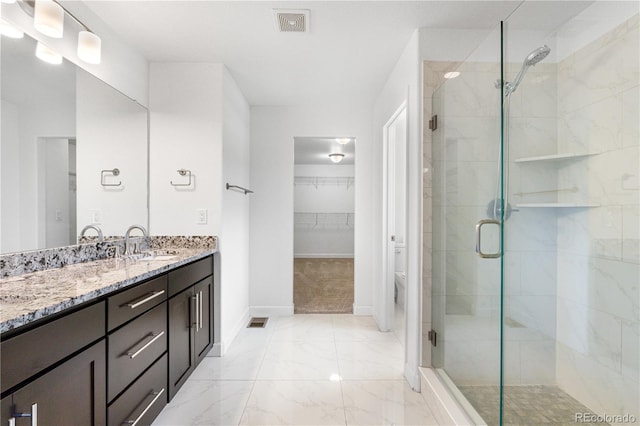 6387 Agave Ave, Castle Rock, CO 80108 - full bathroom with a stall shower, vanity, marble finish flooring, and a spacious closet
