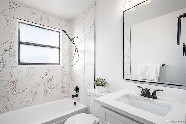 full bathroom with vanity, toilet, and tiled shower / bath