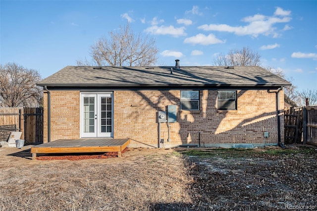 back of property featuring a wooden deck