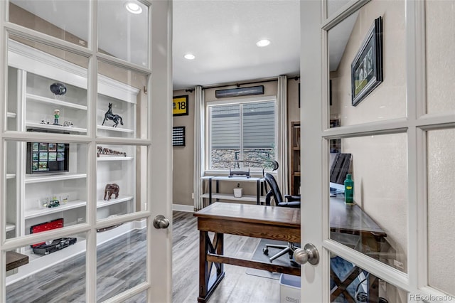 office area with recessed lighting, wood finished floors, and baseboards