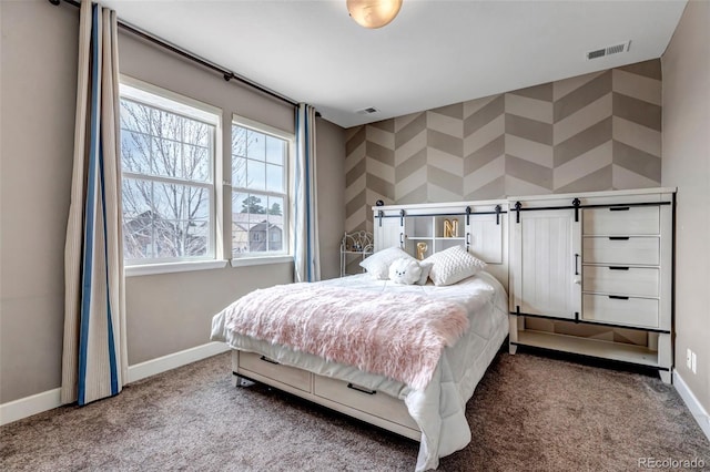 bedroom featuring visible vents, carpet flooring, and baseboards