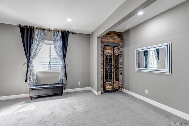 interior space with recessed lighting, baseboards, and carpet