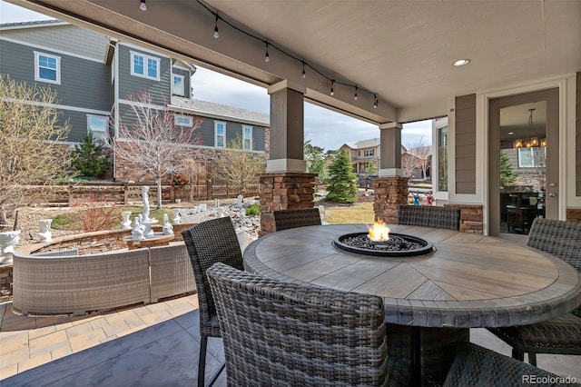 view of patio with an outdoor fire pit