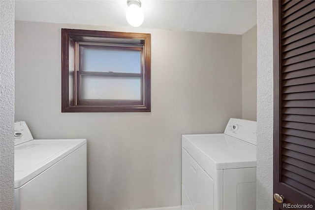 laundry area with laundry area and washer and dryer