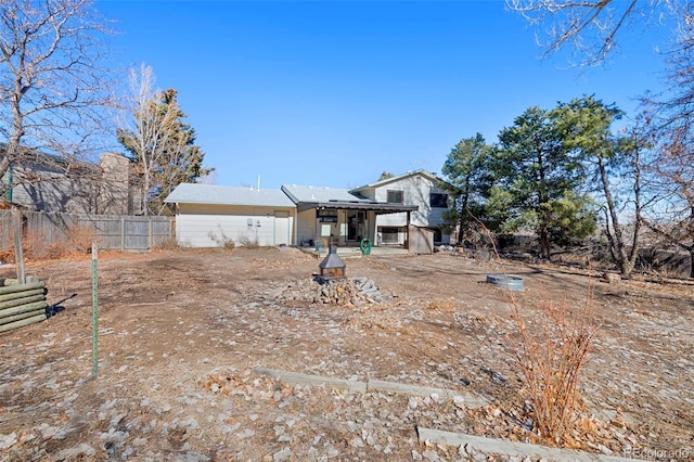 back of property featuring fence