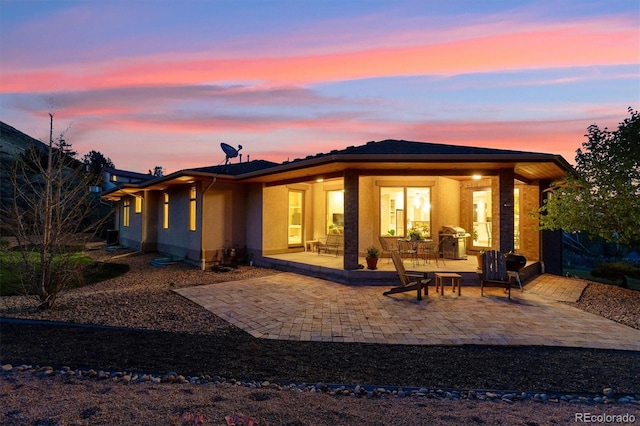 4305 Easley Rd, Golden, CO 80403 - rear view of house featuring a patio and stucco siding