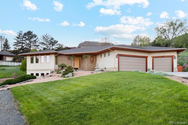 4305 Easley Rd, Golden, CO 80403 - view of front facade featuring concrete driveway, stucco siding, a front yard, and a garage