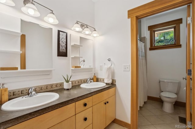 4305 Easley Rd, Golden, CO 80403 - full bath with a sink, tile patterned floors, toilet, and double vanity