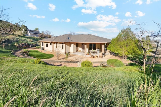 4305 Easley Rd, Golden, CO 80403 - rear view of house featuring a patio area and stucco siding