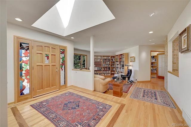 foyer featuring visible vents, wood finished floors, and recessed lighting