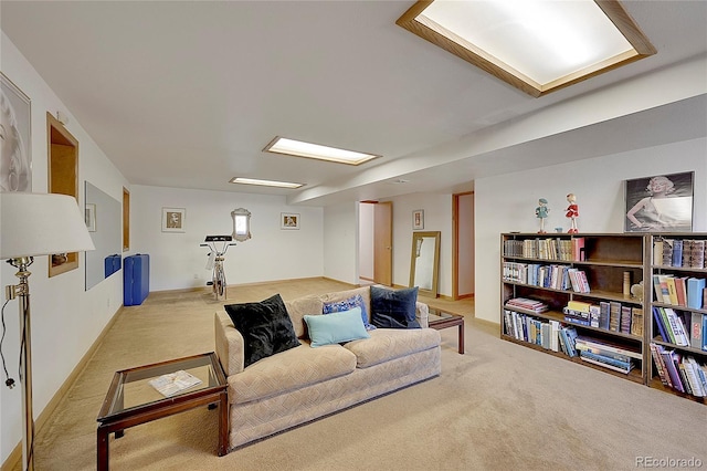 living room featuring carpet floors and baseboards