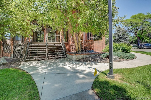 2181 S Troy Way Unit 103, Aurora, CO 80014 - view of front of house featuring brick siding and stairway
