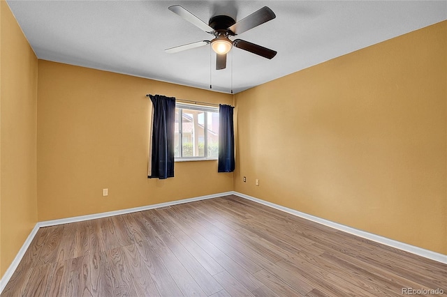 2181 S Troy Way Unit 103, Aurora, CO 80014 - empty room featuring ceiling fan and wood finished floors