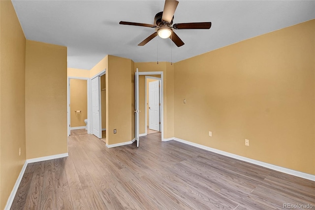 2181 S Troy Way Unit 103, Aurora, CO 80014 - spare room with a ceiling fan and light wood-style flooring