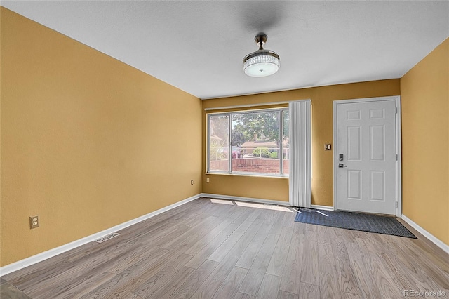 2181 S Troy Way Unit 103, Aurora, CO 80014 - foyer featuring wood finished floors and baseboards