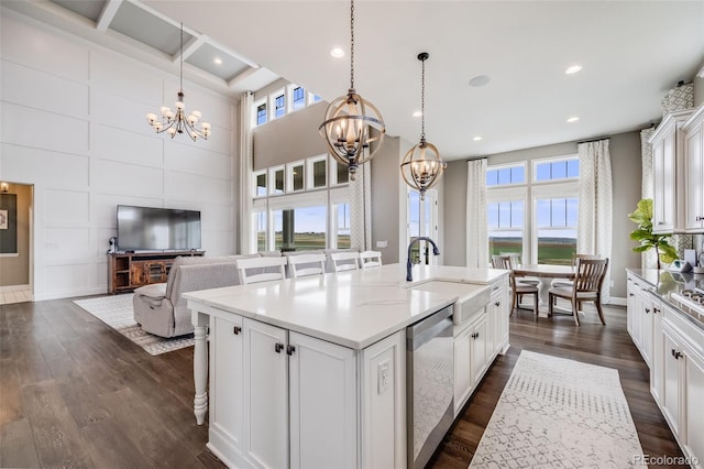 8750 Red Primrose St, Franktown, CO 80116 - kitchen featuring plenty of natural light, stainless steel dishwasher, dark wood-style floors, and a notable chandelier