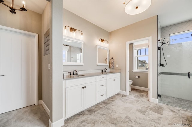 8750 Red Primrose St, Franktown, CO 80116 - full bath featuring double vanity, toilet, a sink, and a stall shower