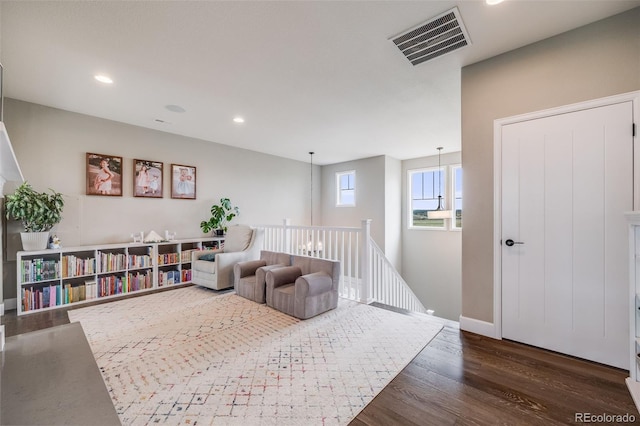 8750 Red Primrose St, Franktown, CO 80116 - living area with baseboards, recessed lighting, wood finished floors, and visible vents