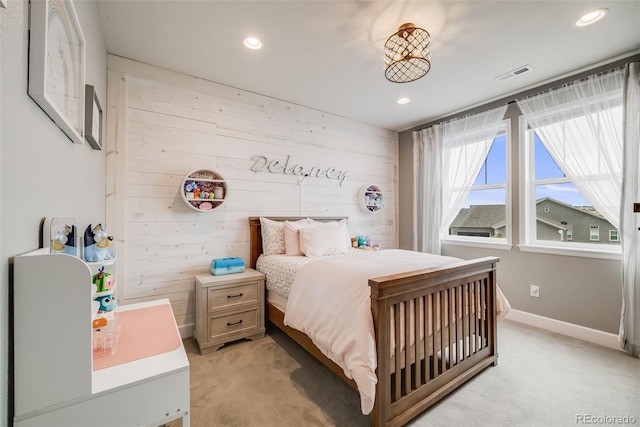 8750 Red Primrose St, Franktown, CO 80116 - bedroom with recessed lighting, wood walls, visible vents, and light carpet