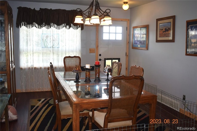 dining space featuring a notable chandelier