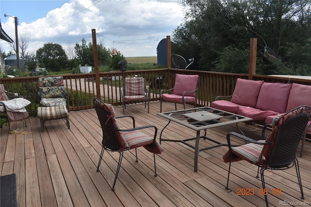 wooden deck featuring an outdoor hangout area