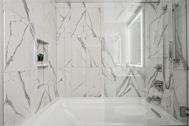 bathroom featuring shower / bath combination with glass door