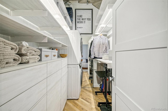 spacious closet featuring light hardwood / wood-style flooring