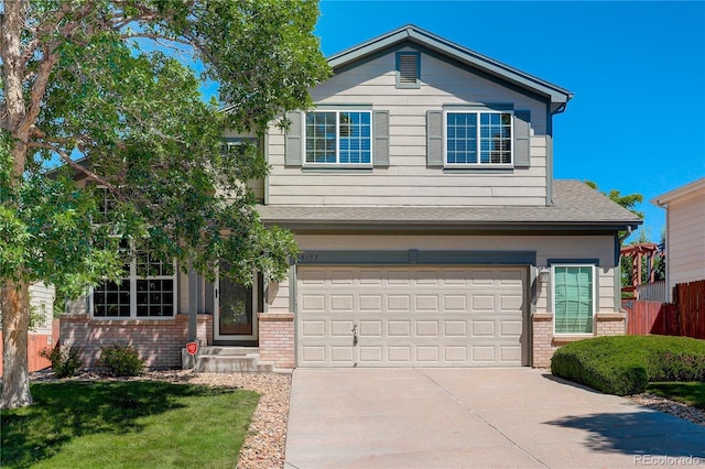 18153 E Amherst Dr, Aurora, CO 80013 - view of front of house featuring brick siding, a garage, concrete driveway, and a shingled roof