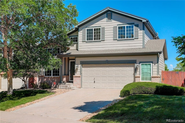 18153 E Amherst Dr, Aurora, CO 80013 - view of front of home with brick siding, a garage, and concrete driveway