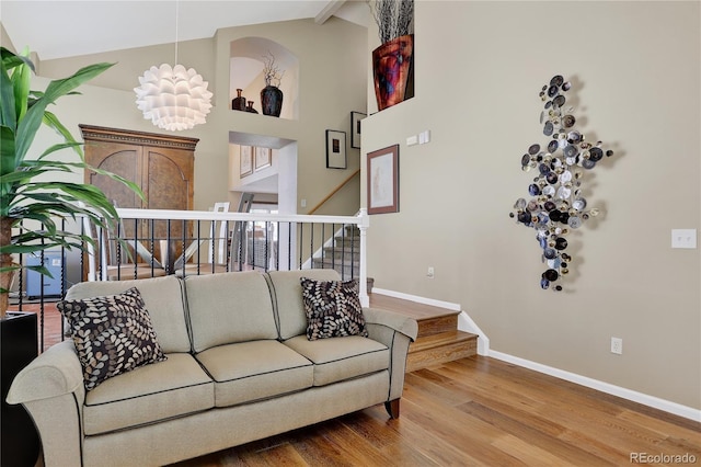 18153 E Amherst Dr, Aurora, CO 80013 - living room with wood finished floors, stairway, high vaulted ceiling, and beamed ceiling