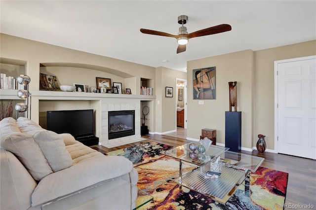 18153 E Amherst Dr, Aurora, CO 80013 - living area with wood finished floors, a ceiling fan, and a tile fireplace