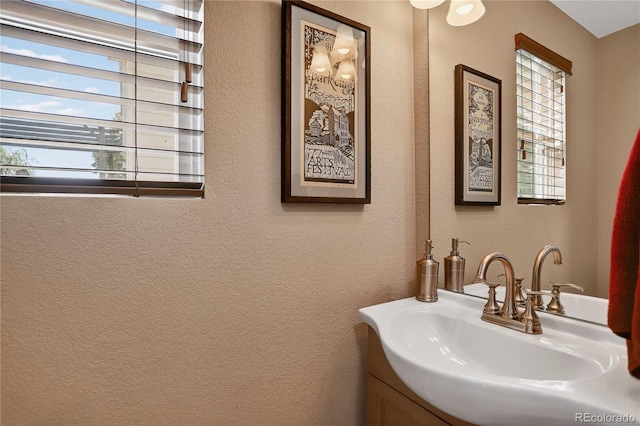 18153 E Amherst Dr, Aurora, CO 80013 - bathroom featuring vanity and a textured wall