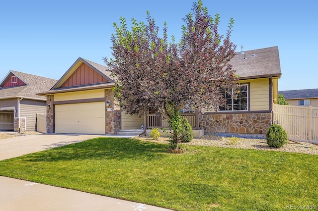 5770 Waverley Ave, Firestone, CO 80504 - view of front of property featuring stone siding, concrete driveway, board and batten siding, an attached garage, and roof with shingles