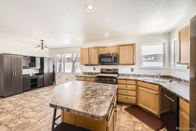 5770 Waverley Ave, Firestone, CO 80504 - kitchen with appliances with stainless steel finishes, a textured ceiling, dark countertops, a kitchen bar, and a chandelier